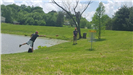 Man Putts Disc to Hole at Litz Park